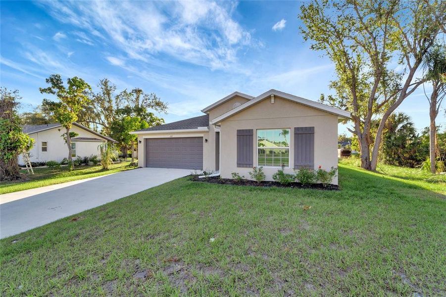 Front exterior of a new home in , Port Charlotte, FL, highlighting curb appeal (Image 1). Front exterior of a new home in , Port Charlotte, FL, highlighting curb appeal (Image 1).