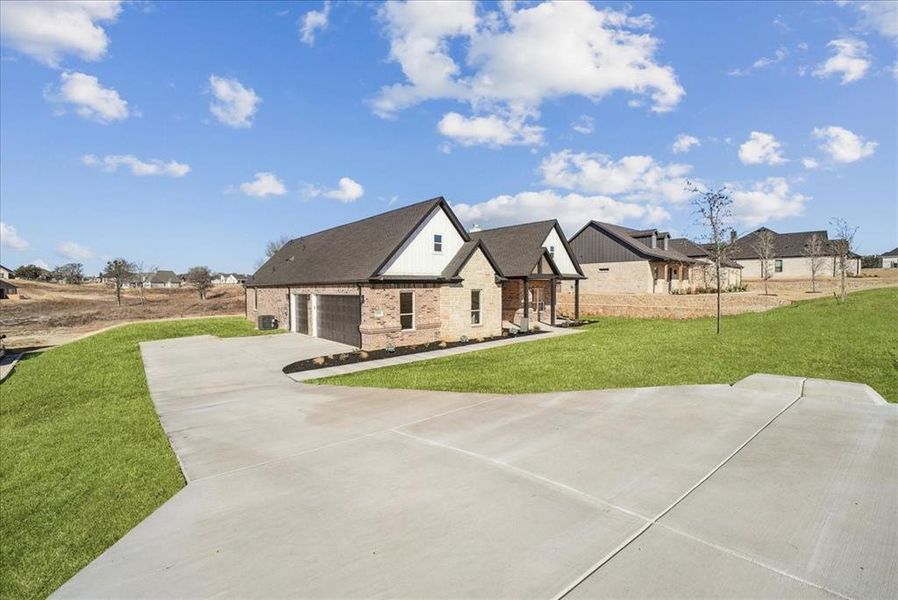 Front exterior of a new home in , Azle, TX, highlighting curb appeal (Image 26).