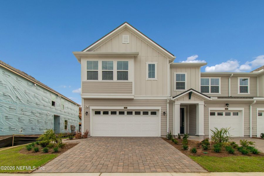 Front exterior of a new home in Westerly Park at Wildlight – Overlook Collection, Yulee, FL, highlighting curb appeal (Image 1). Front exterior of a new home in Westerly Park at Wildlight – Overlook Collection, Yulee, FL, highlighting curb appeal (Image 1).