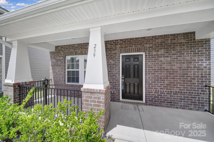 Front exterior of a new home in Preston Park, Pineville, NC, highlighting curb appeal (Image 19). Front exterior of a new home in Preston Park, Pineville, NC, highlighting curb appeal (Image 19).