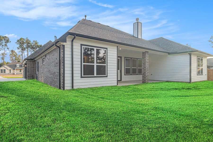 Front exterior of a new home in Deer Pines, Conroe, TX, highlighting curb appeal (Image 23). Front exterior of a new home in Deer Pines, Conroe, TX, highlighting curb appeal (Image 23).