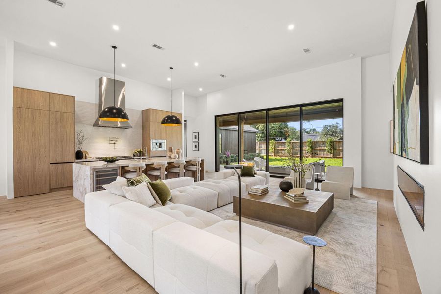 Family Room & Kitchen view #2. Contemporary finishes create a gallery feel to the common areas.