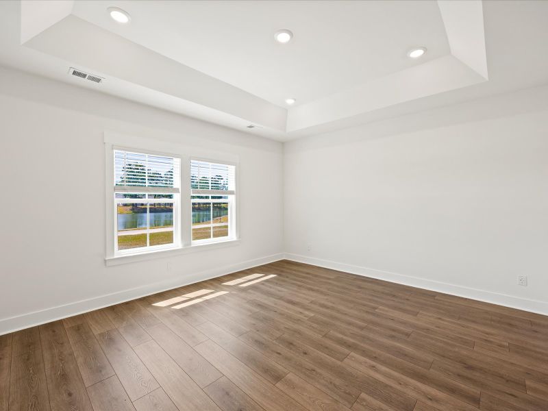 Spacious, unfurnished interior of a new home in The Coves at Lakes of Cane Bay II, Summerville (Image 23).