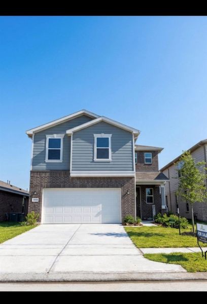 Front exterior of a new home in , Katy, TX, highlighting curb appeal (Image 1). Front exterior of a new home in , Katy, TX, highlighting curb appeal (Image 1).