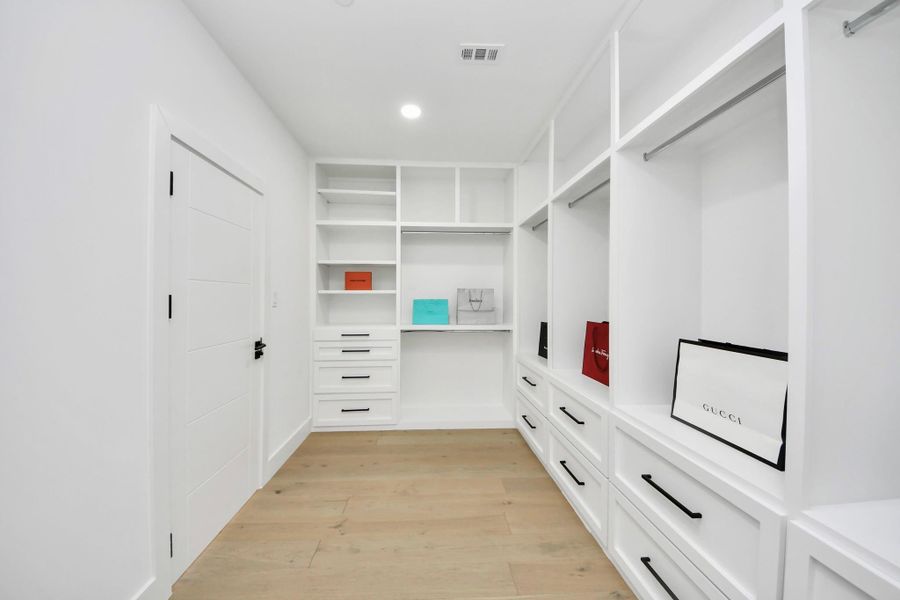 Every detail of the primary closet is curated for convenience and style.