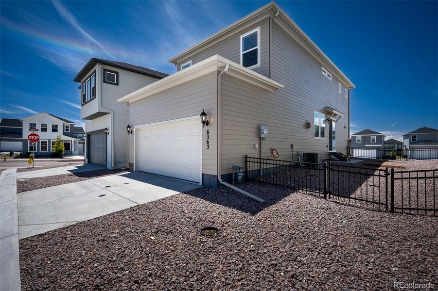 Front exterior of a new home in Revel Crossing at Wolf Ranch – The Ascent Collection, Colorado Springs, CO, highlighting curb appeal (Image 21).