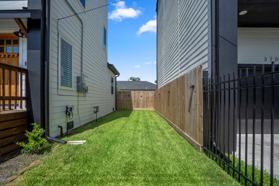 Generously sized, fully fenced backyard—perfect for outdoor entertaining or letting pets roam.
