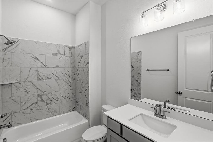 Full bathroom featuring vanity and bathing tub / shower combination