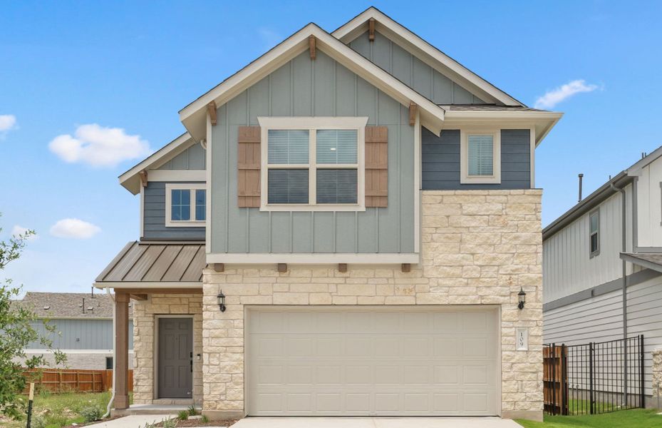 Front exterior of a new home in Santa Rita Ranch, Liberty Hill, TX, highlighting curb appeal (Image 22).