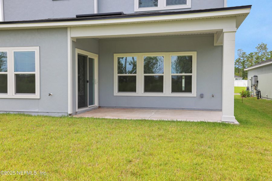 Front exterior of a new home in Cordova Palms, St. Augustine, FL, highlighting curb appeal (Image 16).