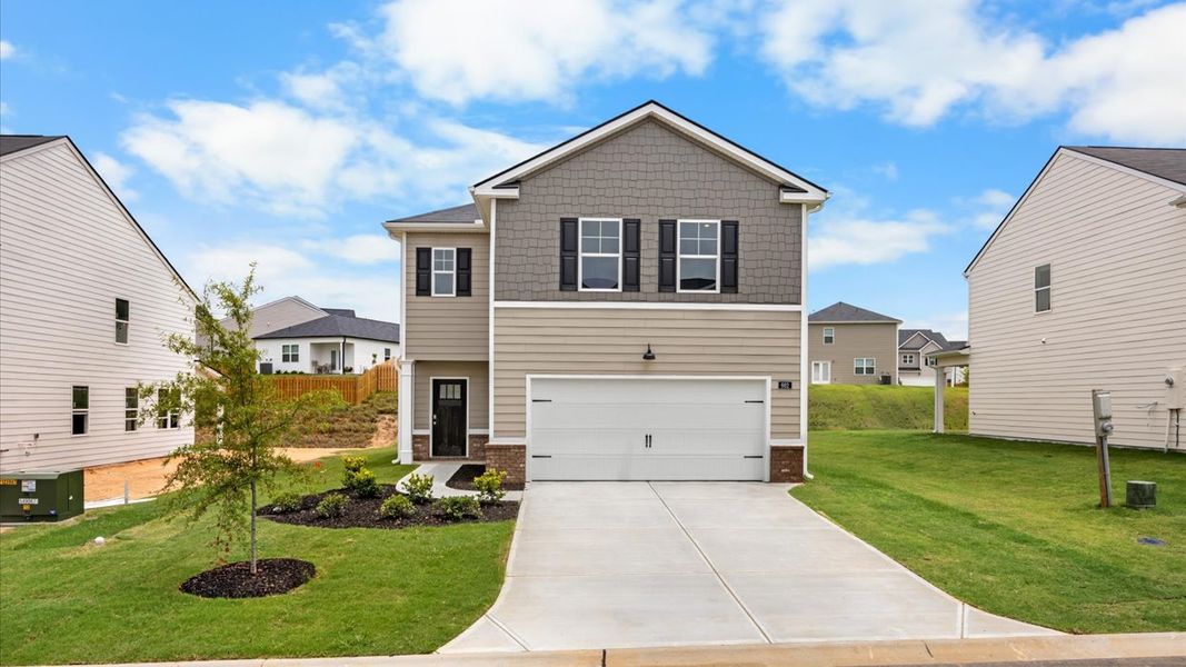 Front exterior of a new home in The Abbey at Trolley Run Station, Aiken, SC, highlighting curb appeal (Image 1). Front exterior of a new home in The Abbey at Trolley Run Station, Aiken, SC, highlighting curb appeal (Image 1).