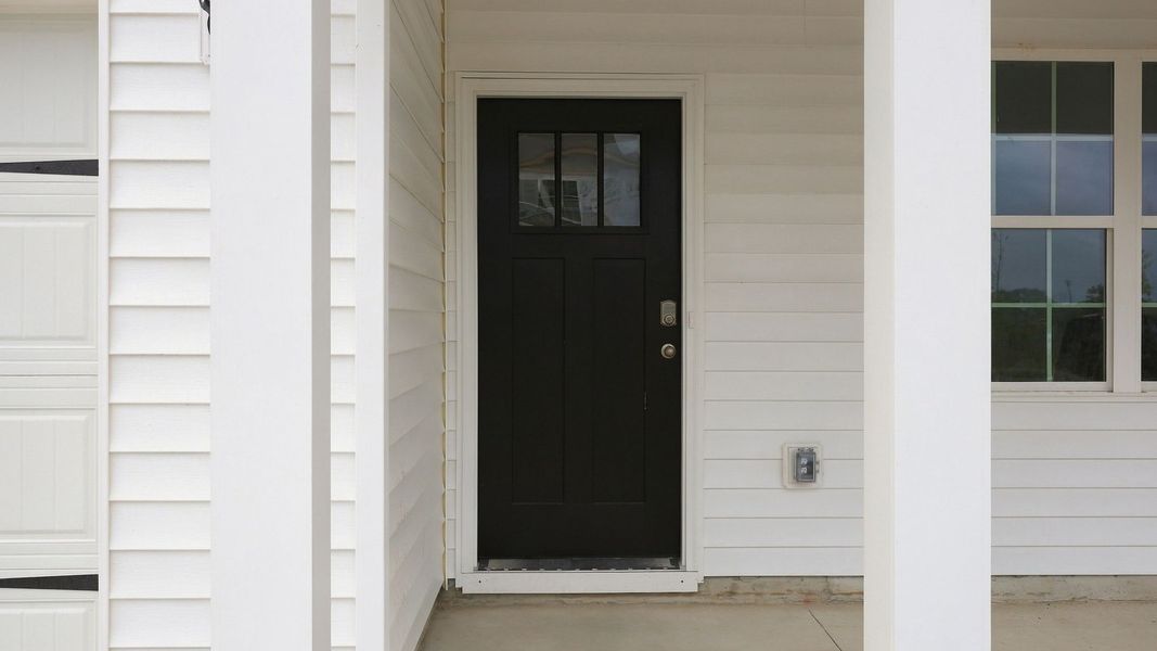 Exterior details and patio area of a home in Ridgewood Farms, Winterville (Image 4).