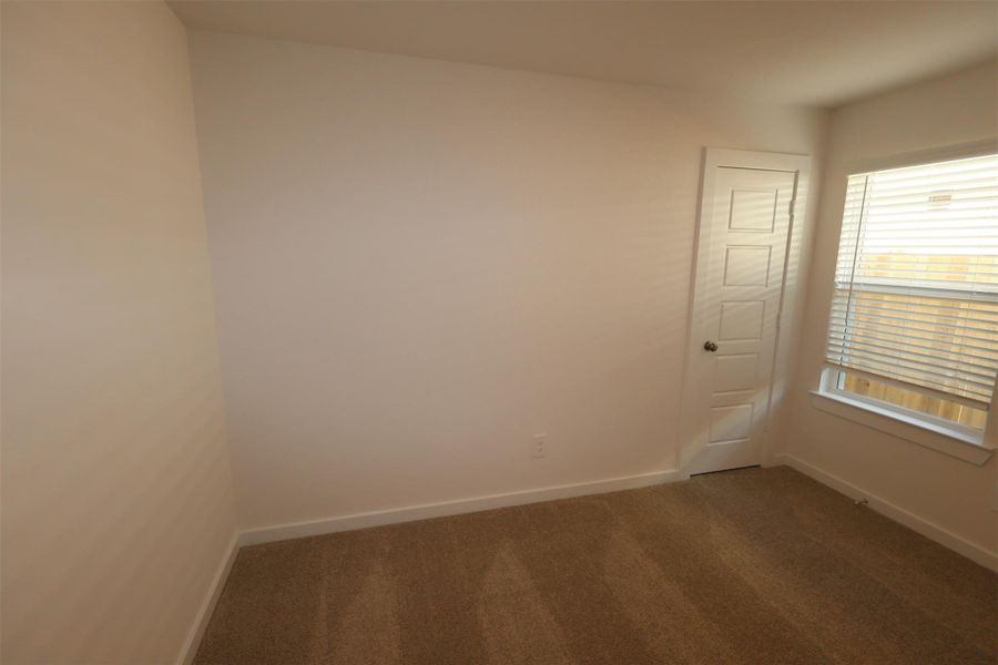 Spacious, unfurnished interior of a new home in Pinewood at Grand Texas, New Caney (Image 11).