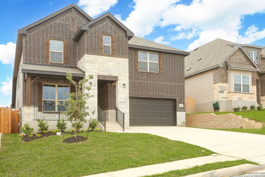 Front exterior of a new home in Vista Ridge, Live Oak, TX, highlighting curb appeal (Image 2). Front exterior of a new home in Vista Ridge, Live Oak, TX, highlighting curb appeal (Image 2).