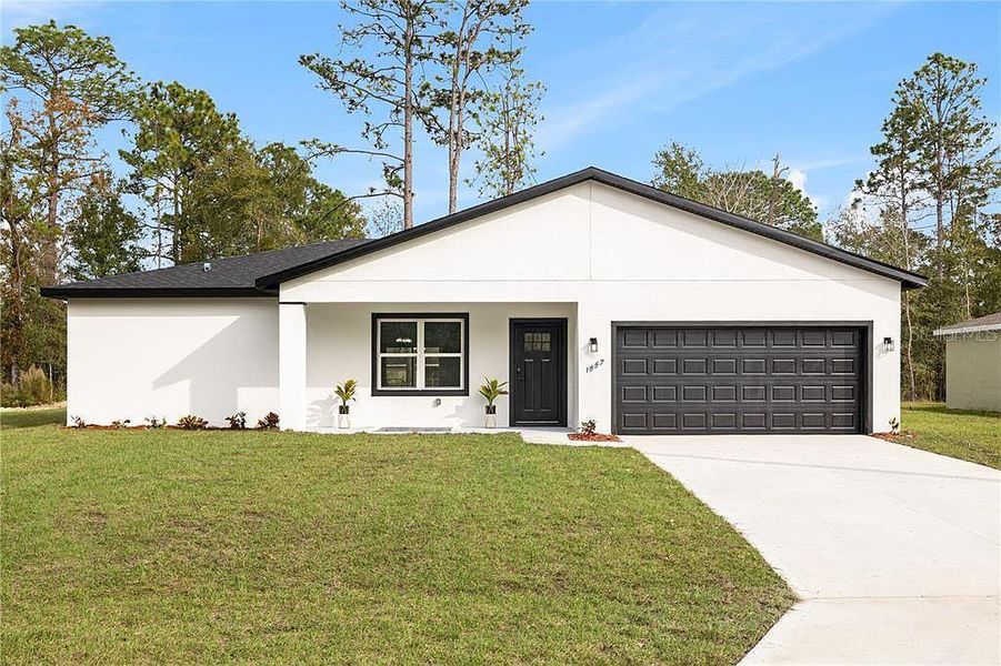 Front exterior of a new home in , Citrus Springs, FL, highlighting curb appeal (Image 1). Front exterior of a new home in , Citrus Springs, FL, highlighting curb appeal (Image 1).