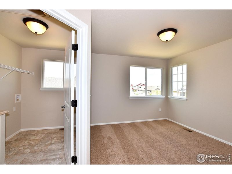 Spacious, unfurnished interior of a new home in Union Colony West, Greeley (Image 22).