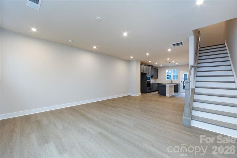 Open concept living with kitchen as the anchor