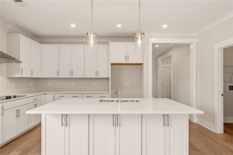 A streamlined kitchen presents ample counter space