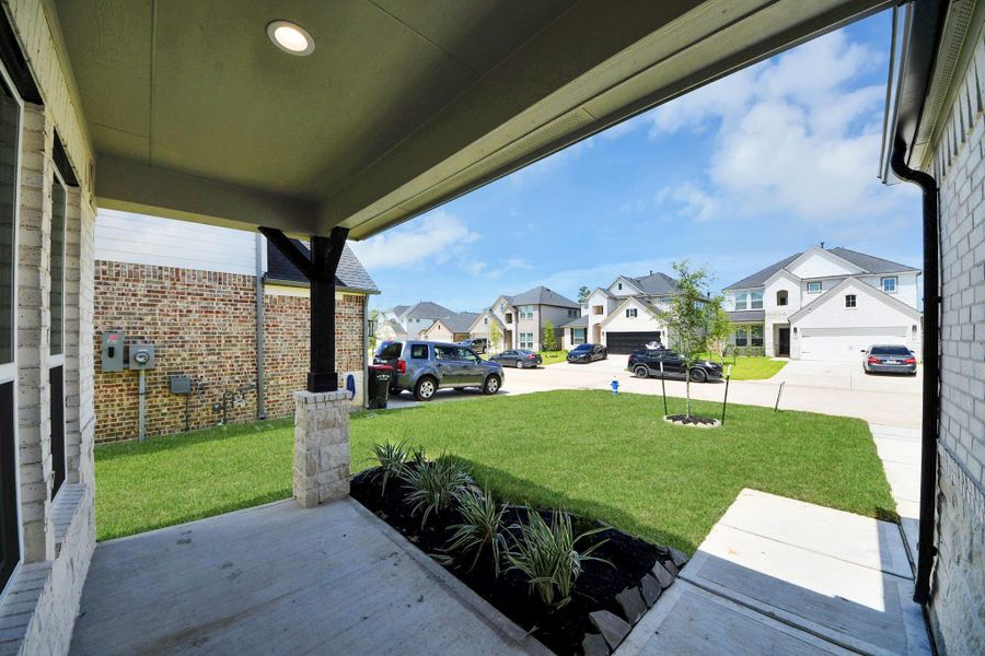 Experience outdoor living at its finest on this expansive covered patio, thoughtfully designed for BBQs and delightful outdoor dining.
