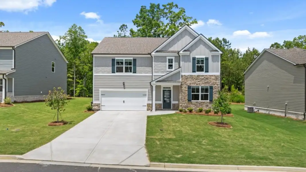Front exterior of a new home in Parkside at Carter Grove, Cartersville, GA, highlighting curb appeal (Image 2). Front exterior of a new home in Parkside at Carter Grove, Cartersville, GA, highlighting curb appeal (Image 2).