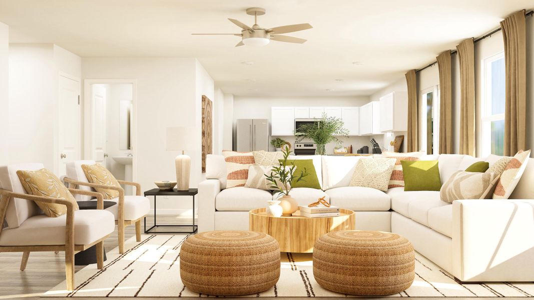 A living room with a white couch and a table.