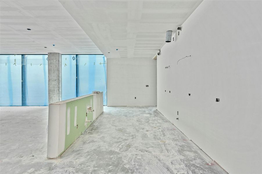 Hallway with concrete flooring