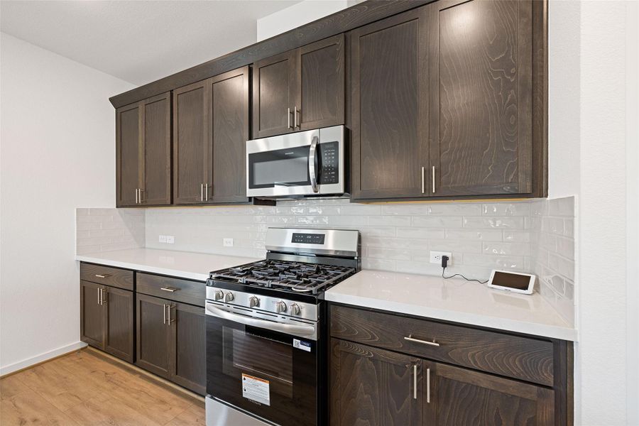 Furnished interior view inside a new home in Sunterra, Katy (Image 8).