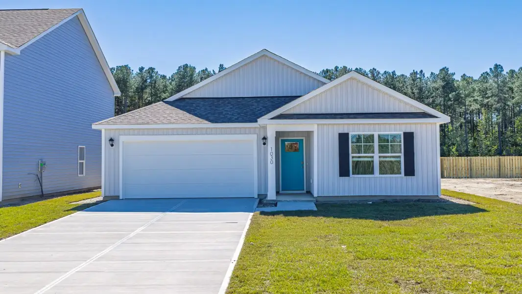 Front exterior of a new home in Saunders Village, Northwest, NC, highlighting curb appeal (Image 1). Front exterior of a new home in Saunders Village, Northwest, NC, highlighting curb appeal (Image 1).