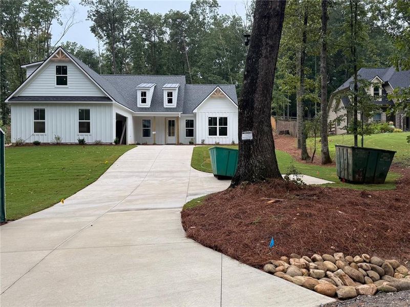 Front exterior of a new home in , Canton, GA, highlighting curb appeal (Image 1). Front exterior of a new home in , Canton, GA, highlighting curb appeal (Image 1).