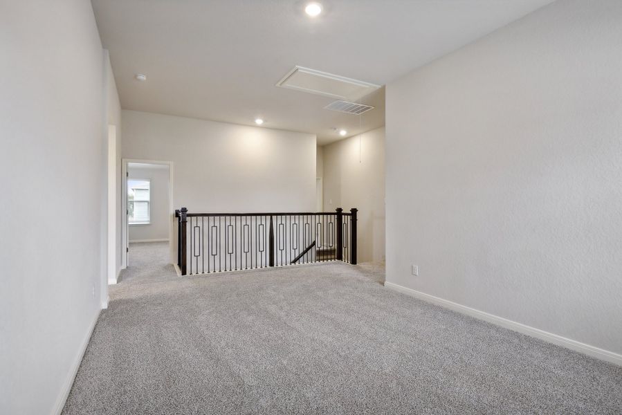 Second floor landing in the Red River floorplan at a Meritage Homes community.