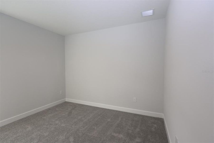 Spacious, unfurnished interior of a new home in Lake Star at Ovation, Winter Garden (Image 17).