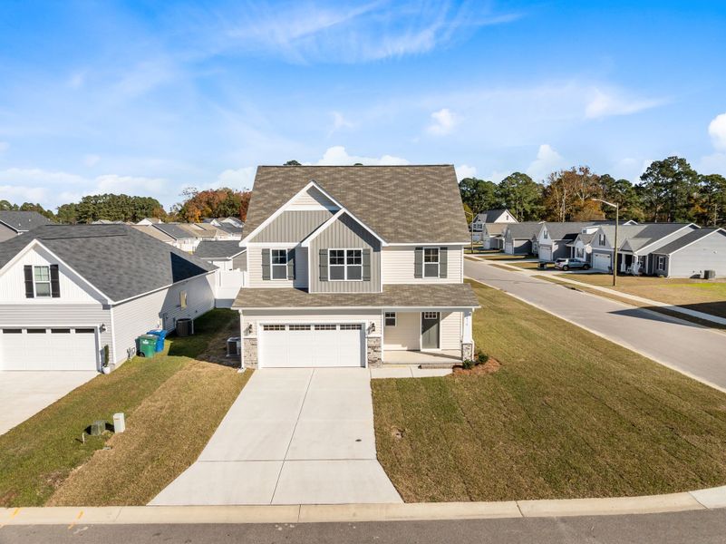 Front exterior of a new home in Arbor Hills South, Greenville, NC, highlighting curb appeal (Image 20).