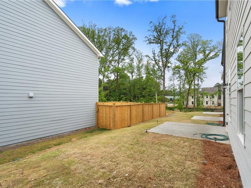 Exterior details and patio area of a home in The Village at Shallowford, Kennesaw (Image 2).