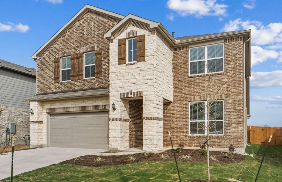 Front exterior of a new home in Lagos, Manor, TX, highlighting curb appeal (Image 20).