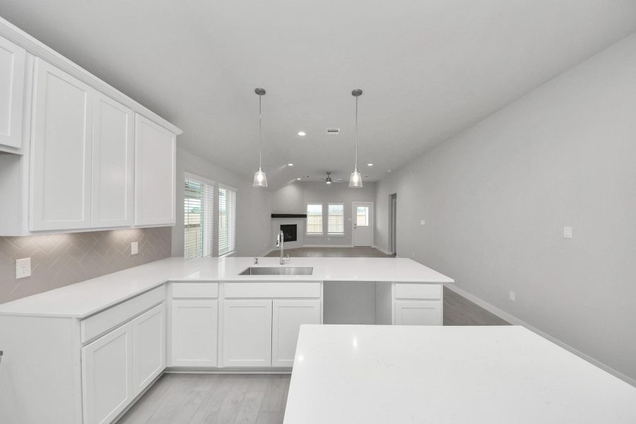 This generously spacious kitchen is a dream realized! Sample photo of completed home with similar floor plan. Actual colors and selections may vary.