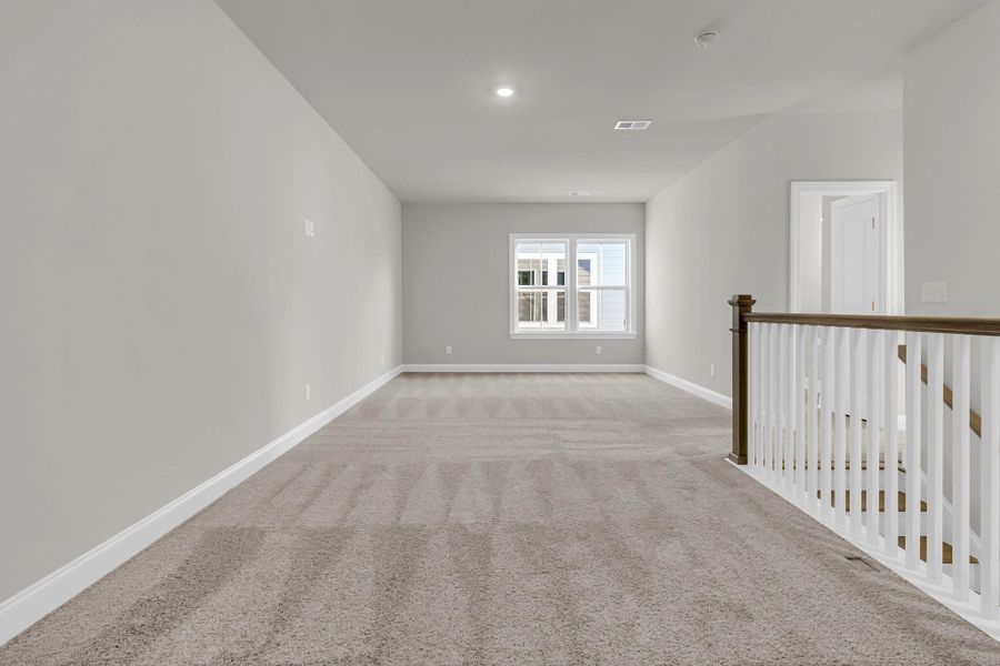 Spacious, unfurnished interior of a new home in Tidewater at Lakes of Cane Bay, Summerville (Image 30).