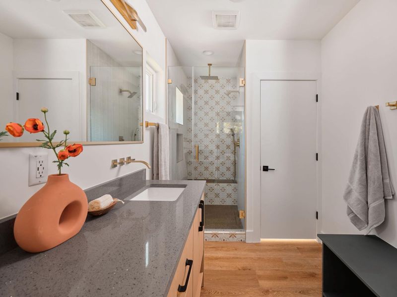 Full bathroom featuring light wood-style floors, vanity, and a shower stall Full bathroom featuring light wood-style floors, vanity, and a shower stall