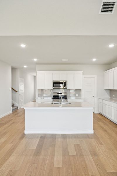 Kitchen in the Masters home plan by Trophy Signature Homes – REPRESENTATIVE PHOTO