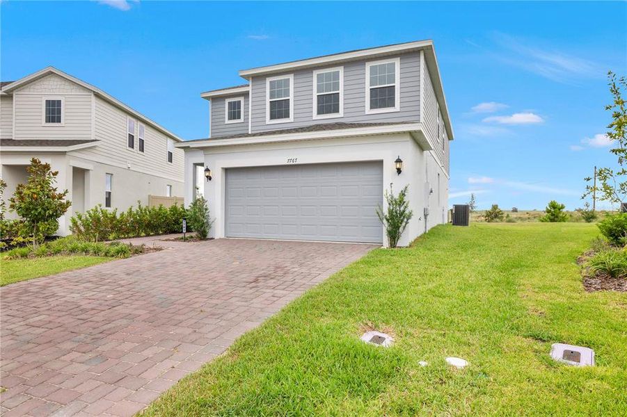 Front exterior of a new home in , Clermont, FL, highlighting curb appeal (Image 2). Front exterior of a new home in , Clermont, FL, highlighting curb appeal (Image 2).
