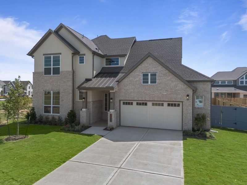 Front exterior of a new home in Fulshear Lakes, Fulshear, TX, highlighting curb appeal (Image 27). Front exterior of a new home in Fulshear Lakes, Fulshear, TX, highlighting curb appeal (Image 27).