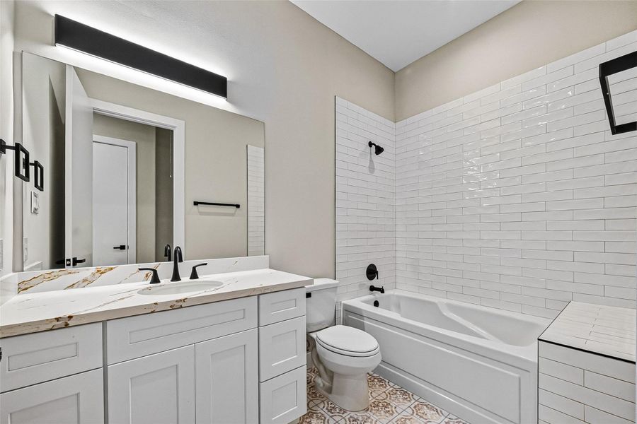 Secondary bathroom view showing vanity and fixtures. Secondary bathroom view showing vanity and fixtures.