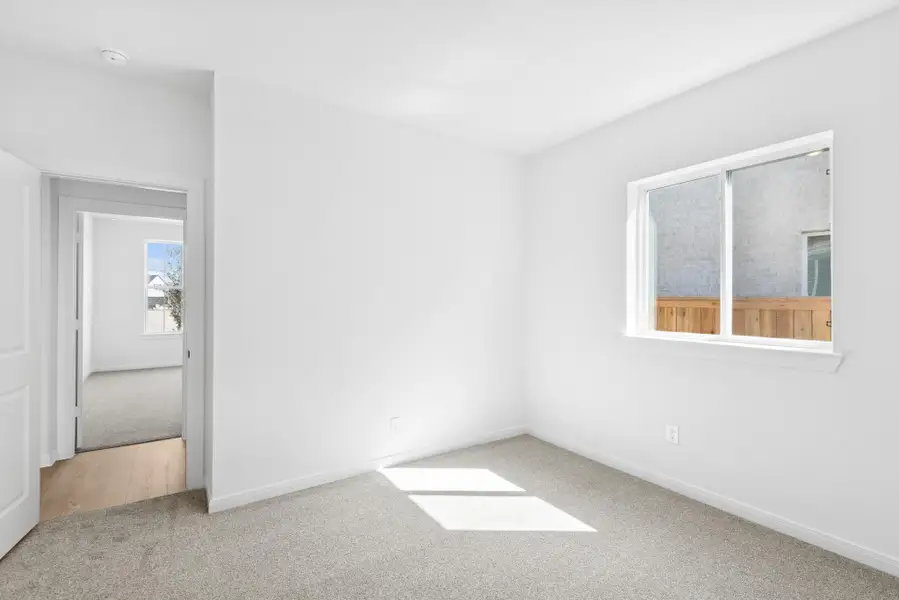 Spacious, unfurnished interior of a new home in The Grand Prairie 50’, Hockley (Image 11).