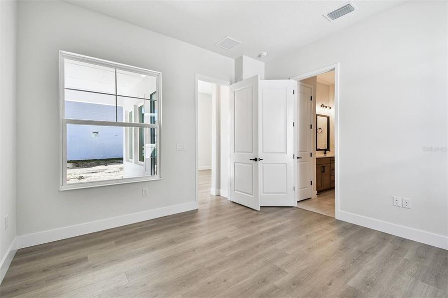 Spacious, unfurnished interior of a new home in Emerald Landing at Waterside at Lakewood Ranch – Cottage Series, Sarasota (Image 36).