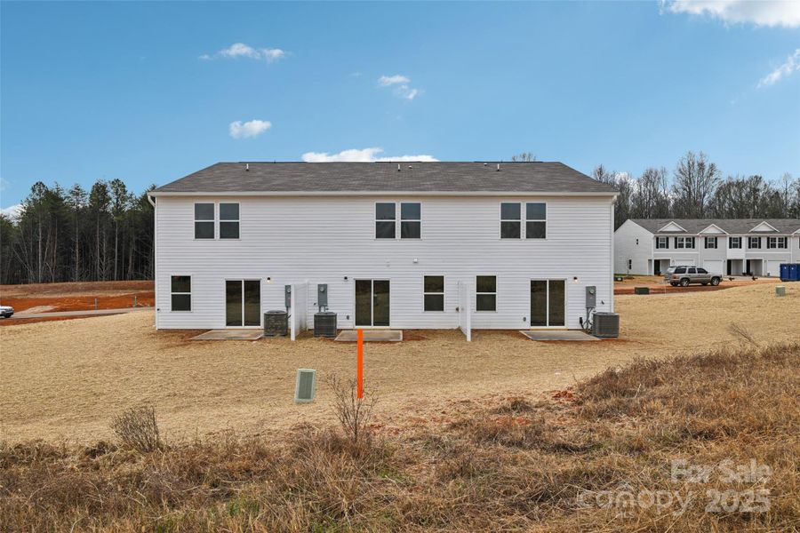 Exterior details and patio area of a home in The Towns at Green Needles, Lexington (Image 10).