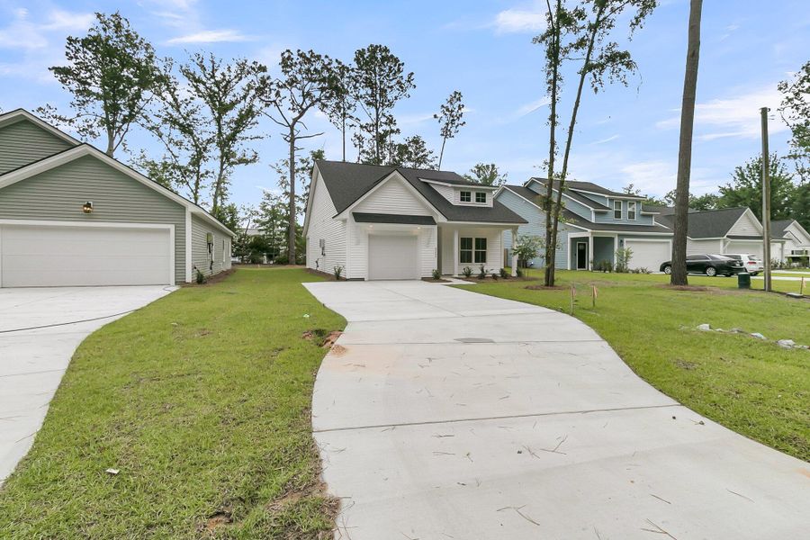 Front exterior of a new home in , Ladson, SC, highlighting curb appeal (Image 20).