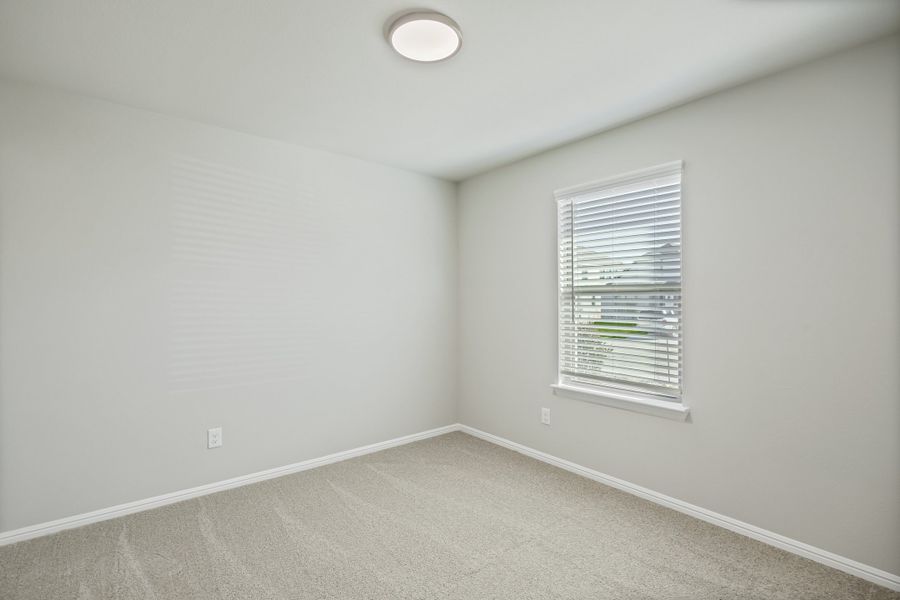 Bedroom in the Hadley home plan by Trophy Signature Homes – REPRESENTATIVE PHOTO