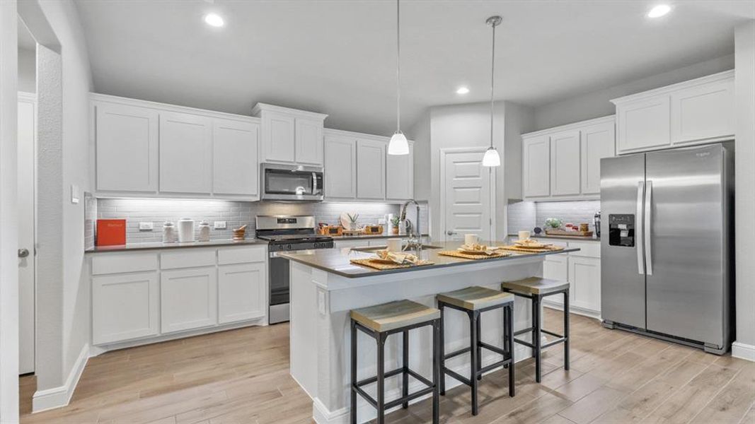 Kitchen - All Home and community information, including pricing, included features, terms, availability and amenities, are subject to change at any time without notice or obligation. All Drawings, pictures, photographs, video, square footages, floor plans, elevations, features, colors and sizes are approximate for illustration purposes only and will vary from the homes as built.