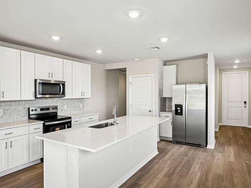 Furnished interior view inside a new home in Crescent Lakes - Premier Series, Punta Gorda (Image 6).