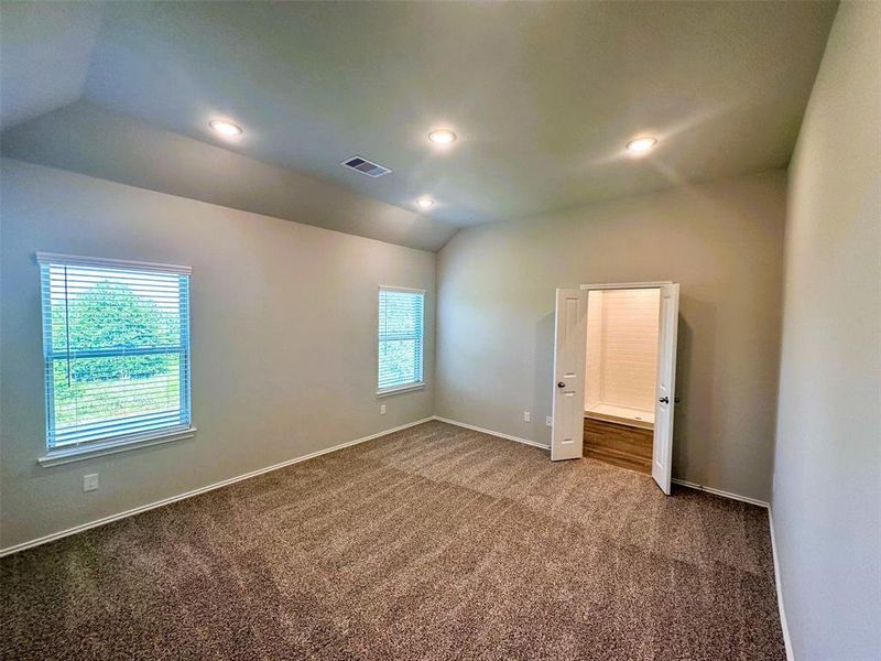 Master bedroom with vaulted ceilings