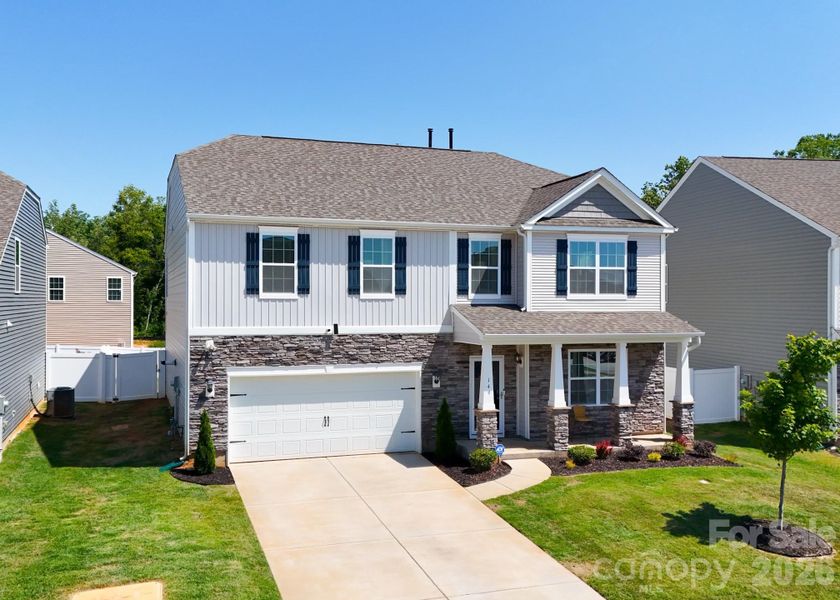 Front exterior of a new home in Wallace Springs, Statesville, NC, highlighting curb appeal (Image 23). Front exterior of a new home in Wallace Springs, Statesville, NC, highlighting curb appeal (Image 23).